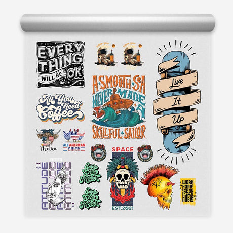 Roll of gang sheets featuring designs like 'Everything will be OK', space theme, skulls, coffee, and skateboarding